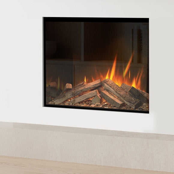 Modern electric fireplace in a living room with wooden cabinets and a white wall.