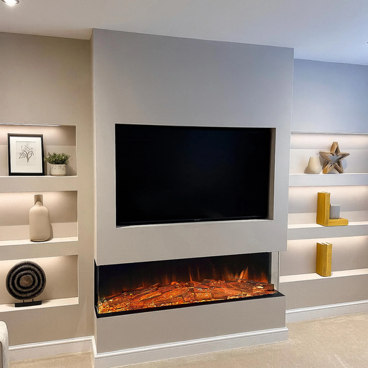 A modern wall-mounted fireplace with a black TV screen above a glowing electric firebox, set into a light gray wall with built-in shelving on both sides.
